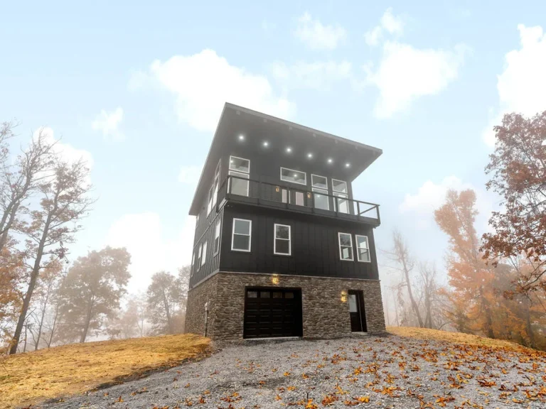 Exterior view of a 3-story black custom home, representing services by Martinsburg Construction Company