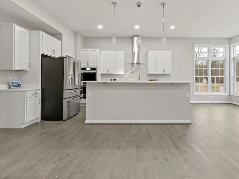 Full view of a white-themed kitchen in a custom home