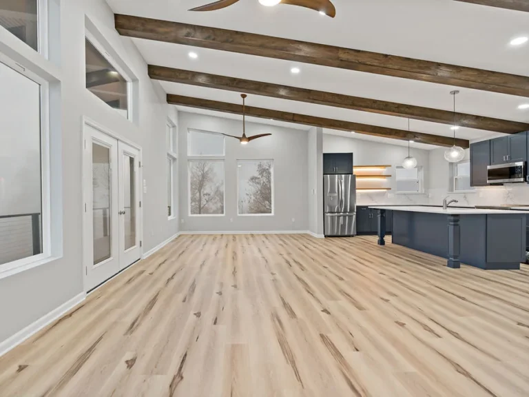 Open white-themed kitchen in a custom home