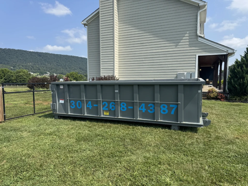 Triple Crown dumpster container placed in front of a house