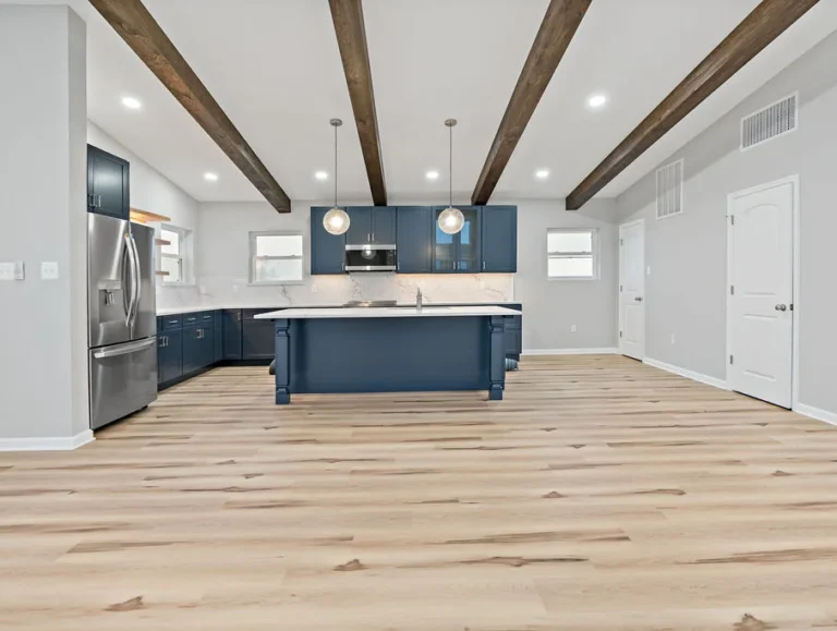 Custom-built kitchen with white and blue color scheme for custom home building
