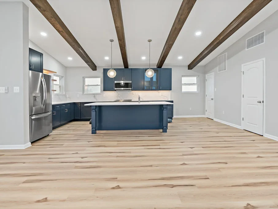 Custom-built kitchen with white and blue color scheme for custom home building